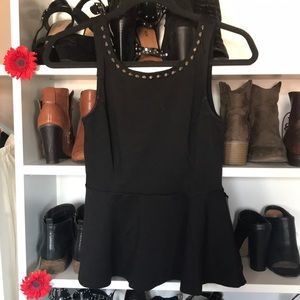 Black peplum top with spike details